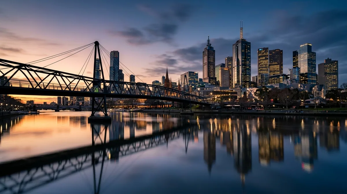 The Melbourne skyline reflected in the Yarra River at golden hour