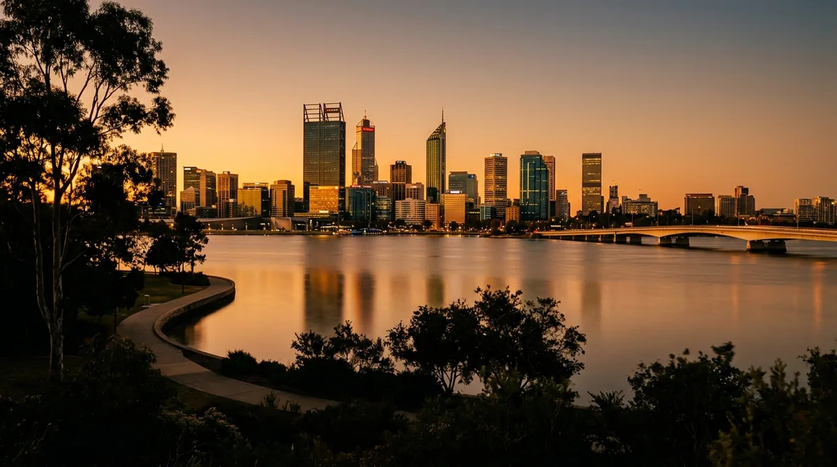 The Perth skyline across the calm Swan River at golden hour