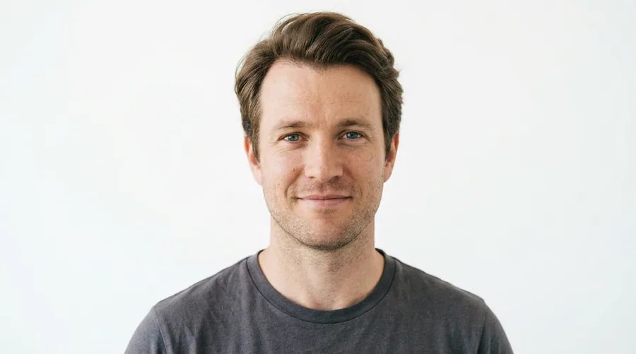 Portrait of a British man in his thirties with full natural hair